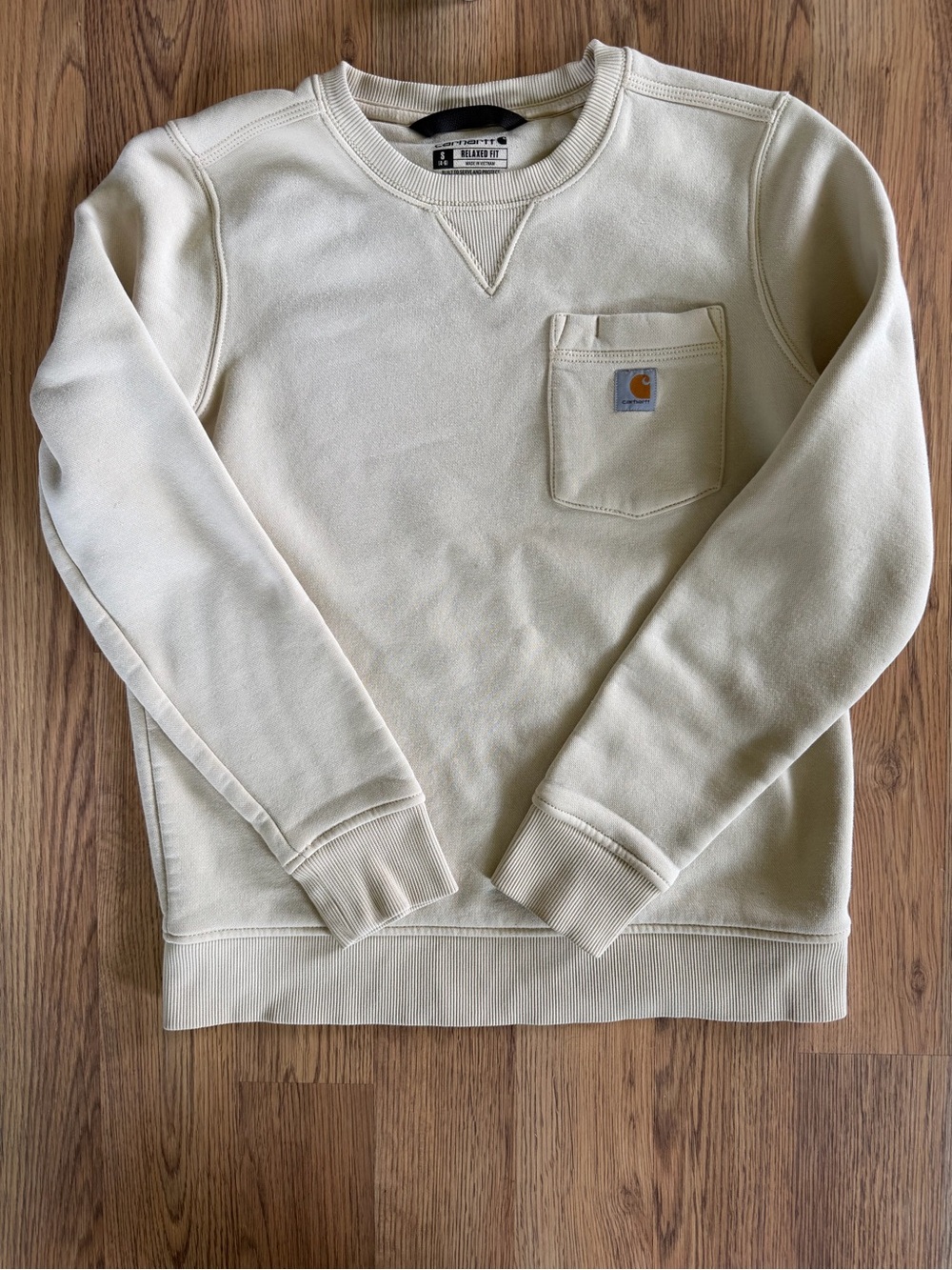 Light yellow women’s size small carhartt crewneck